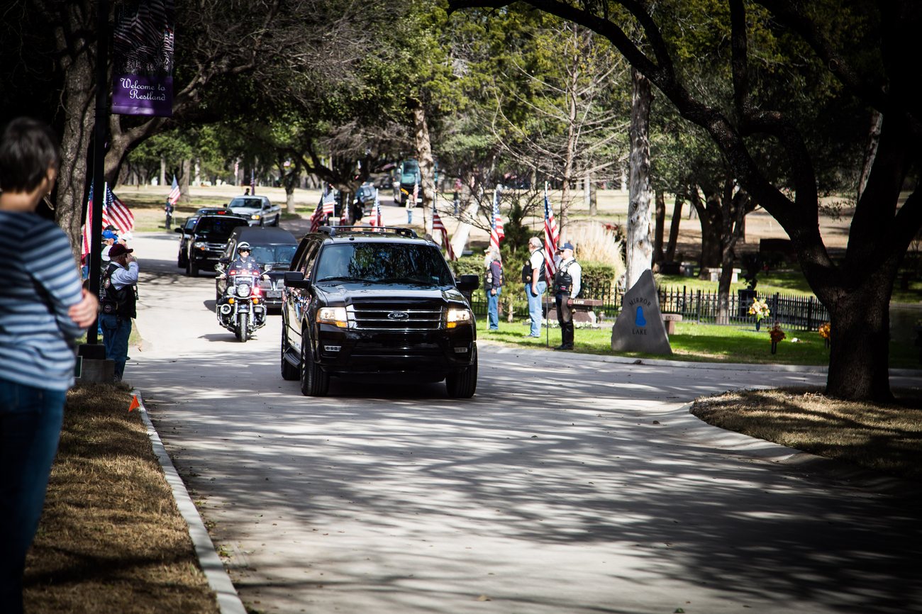 Police honor guard folding the flag